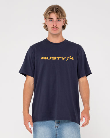 Man wearing Vital Rusty Short Sleeve Tee in Navy Blue