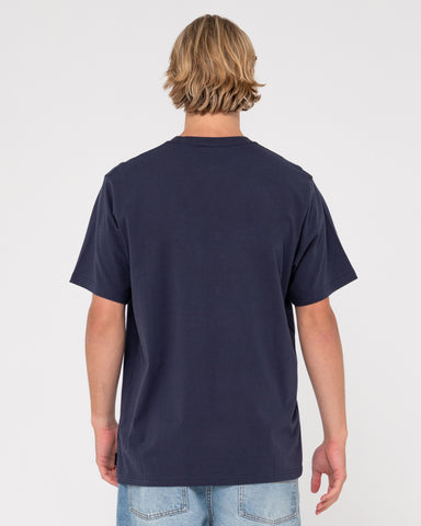 Man wearing Vital Rusty Short Sleeve Tee in Navy Blue