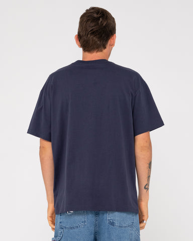 Man wearing Outta Here Short Sleeve Tee in Navy