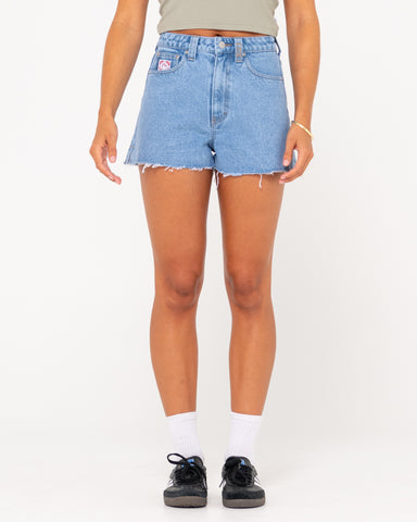 Woman wearing Penny Kick Flare Denim Short in Blue Lagoon