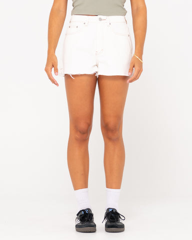 Woman wearing Penny Kick Flare Denim Short in White