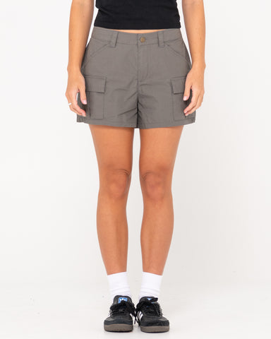 Woman wearing Milly Mid Rise Cargo Short in Coal