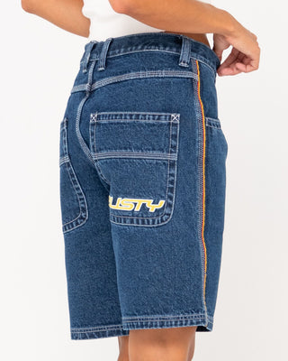 Woman wearing Flip Mommy Low Rise Wide Leg Denim Short in Deep Sea Blue / Red Gold