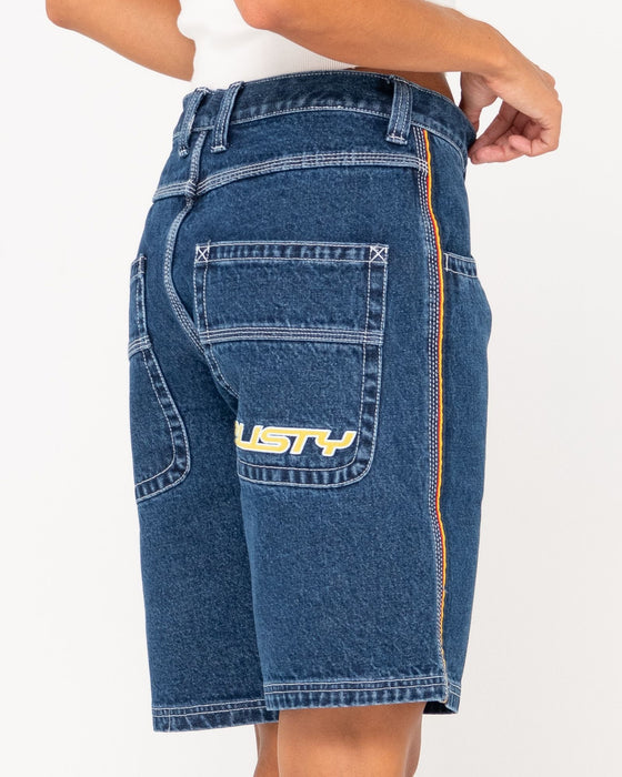 woman-wearing-flip-mommy-low-rise-wide-leg-denim-short-in-deep-sea-blue-red-gold