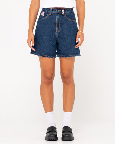 Woman wearing Cyprus Lucky High Denim Short in Deep Blue