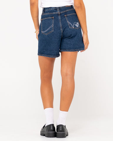 Woman wearing Cyprus Lucky High Denim Short in Deep Blue