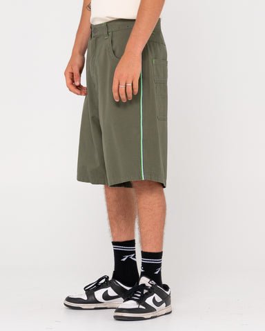 Man wearing Rip Daddy Ripstop Short in Army Green / Classic Green