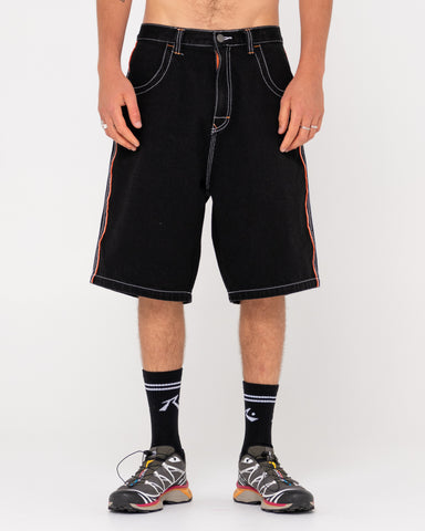 Man wearing Flip Daddy Draggin Jort-black Out in Black Out / Orange