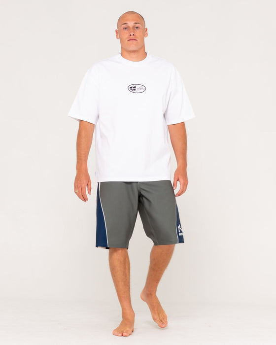 man-wearing-plot-twist-boardshort-in-shadow-army