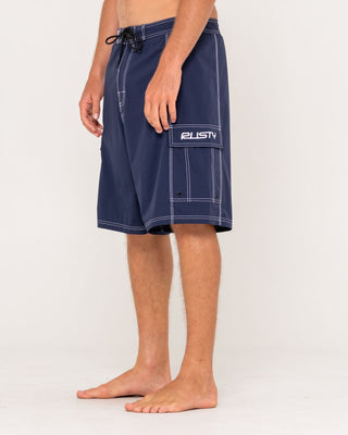 Man wearing Pick Pocket Fixed Waist Boardshort in Navy Blue