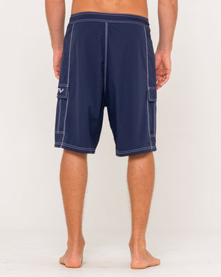 Man wearing Pick Pocket Fixed Waist Boardshort in Navy Blue