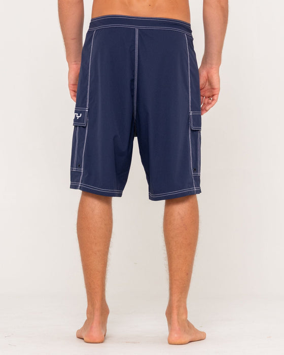 man-wearing-pick-pocket-fixed-waist-boardshort-in-navy-blue