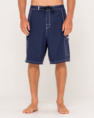 Man wearing Pick Pocket Fixed Waist Boardshort in Navy Blue