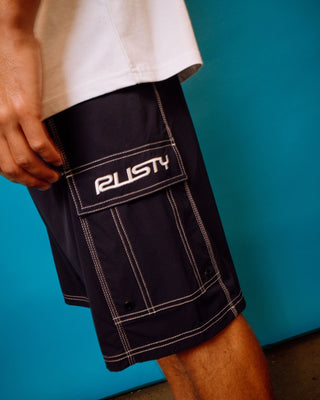 Man wearing Pick Pocket Fixed Waist Boardshort in Navy Blue