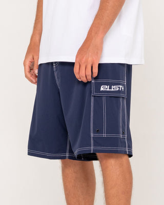 Man wearing Pick Pocket Fixed Waist Boardshort in Navy Blue