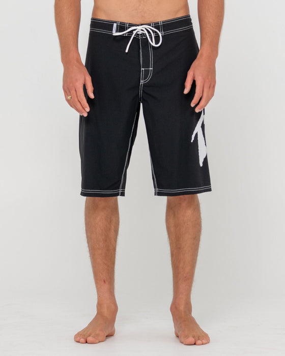 man-wearing-fixed-competition-revolution-boardshort-in-black