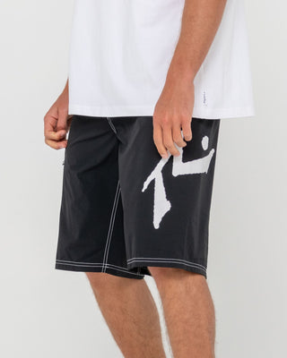 Man wearing Fixed Competition Revolution Boardshort in Black