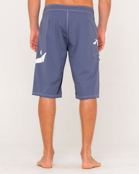 man-wearing-fixed-competition-revolution-boardshort-in-china-blue