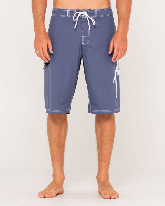 man-wearing-fixed-competition-revolution-boardshort-in-china-blue