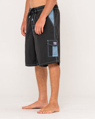 Man wearing Tech Mechanisms Boardshort in Black 1
