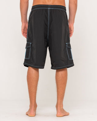 Man wearing Tech Mechanisms Boardshort in Black 1