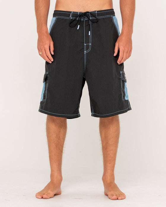 man-wearing-tech-mechanisms-boardshort-in-black-1