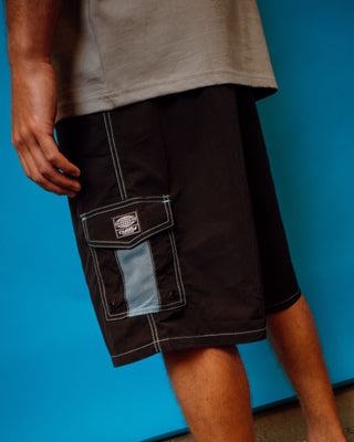 Man wearing Tech Mechanisms Boardshort in Black 1