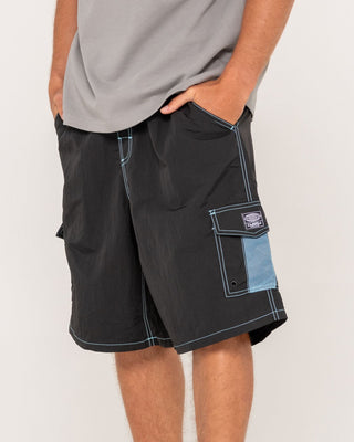 Man wearing Tech Mechanisms Boardshort in Black 1