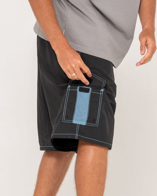 Man wearing Tech Mechanisms Boardshort in Black 1