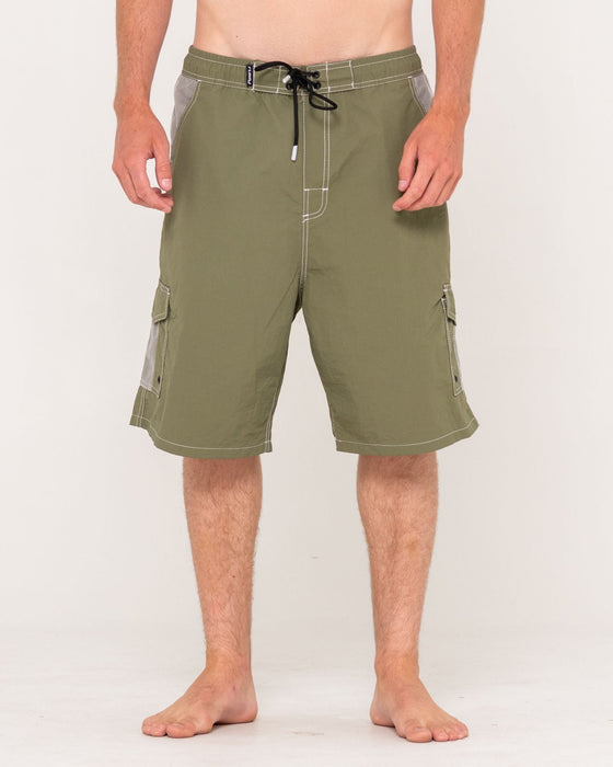man-wearing-tech-mechanisms-boardshort-in-savanna