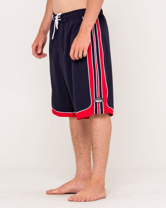 man-wearing-panel-crank-boardshort-in-navy-blue