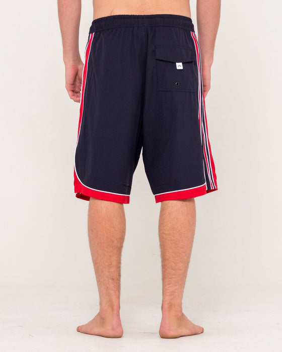 man-wearing-panel-crank-boardshort-in-navy-blue
