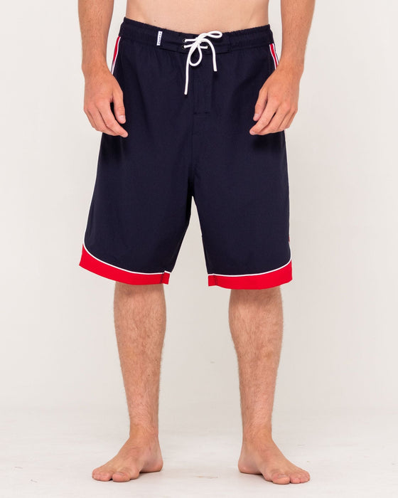 man-wearing-panel-crank-boardshort-in-navy-blue