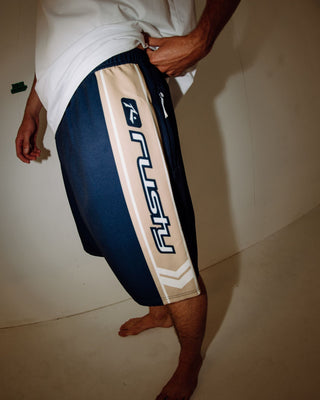 Man wearing Spitfire Hybrid Waist Boardshort in Navy Blue