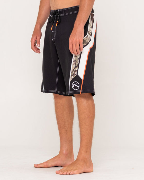 man-wearing-chopper-treed-fixed-waist-boardshort-in-black