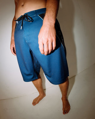 Man wearing Stingray Fixed Waist Boardshort in Atlantic Blue