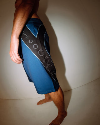 Man wearing Stingray Fixed Waist Boardshort in Atlantic Blue