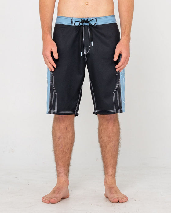 man-wearing-tombstones-fixed-waist-boardshort-in-black