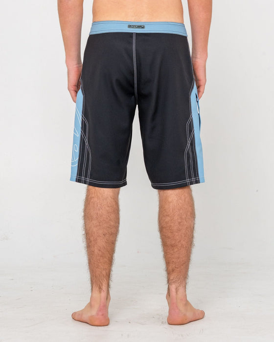 man-wearing-tombstones-fixed-waist-boardshort-in-black