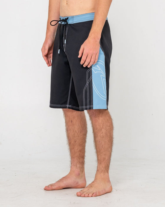 man-wearing-tombstones-fixed-waist-boardshort-in-black