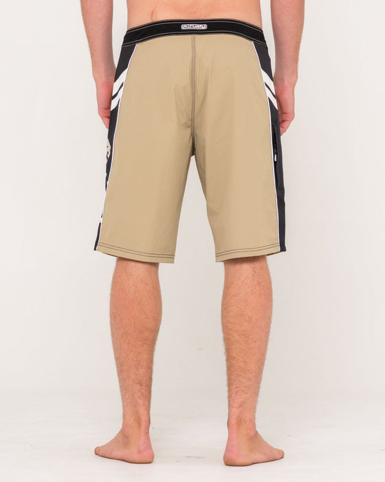 man-wearing-stone-cold-fixed-waist-boardshort-in-abbey-stone
