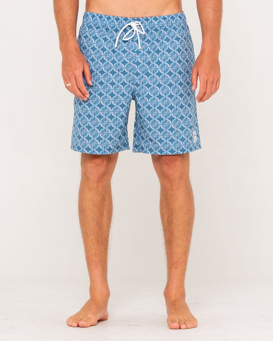 man-wearing-all-over-elastic-waist-boardshort-in-china-blue