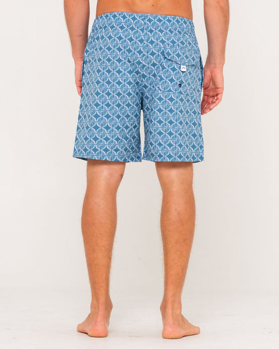 man-wearing-all-over-elastic-waist-boardshort-in-china-blue