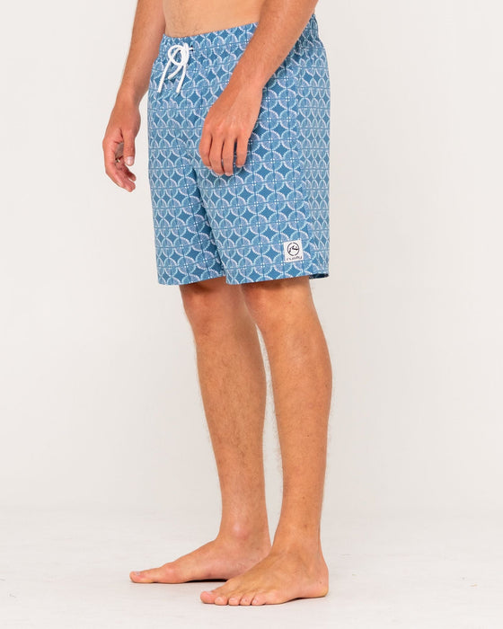 man-wearing-all-over-elastic-waist-boardshort-in-china-blue