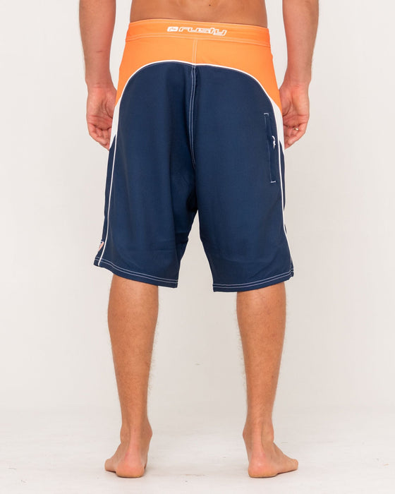 man-wearing-straight-pipe-fixed-waist-boardshort-in-navy-blue