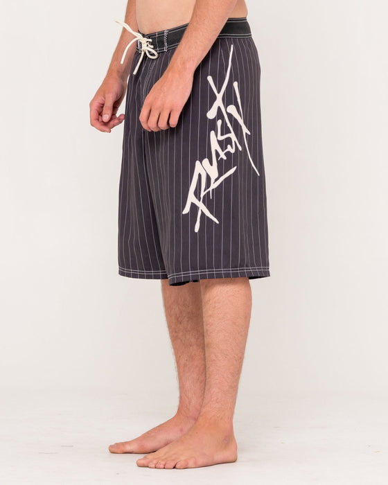 man-wearing-hoodus-fixed-waist-boardshort-in-carbon