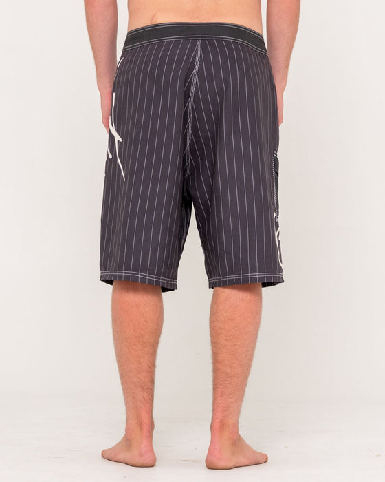 man-wearing-hoodus-fixed-waist-boardshort-in-carbon