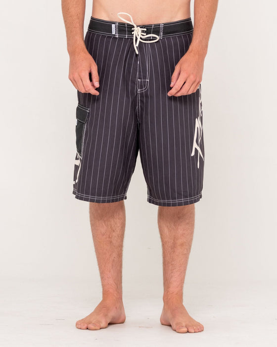 man-wearing-hoodus-fixed-waist-boardshort-in-carbon