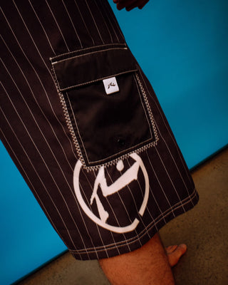 Man wearing Hoodus Fixed Waist Boardshort in Carbon