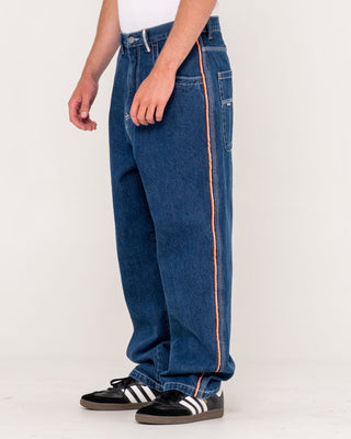 Man wearing Flip Daddy 2.0 Jean - Deep Sea Blue in Deep Sea Blue / Orange